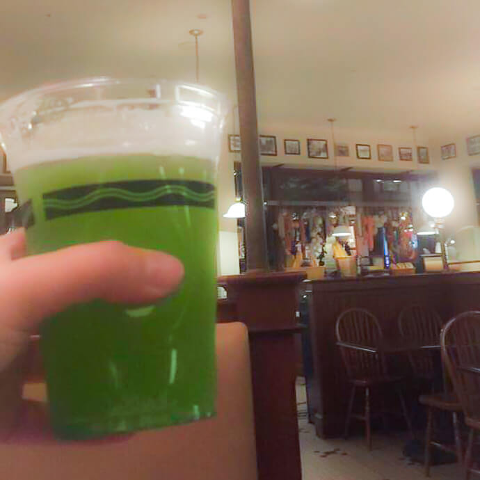 Pictured: Seasonal Halloween Green Beer Cocktail at New York Deli