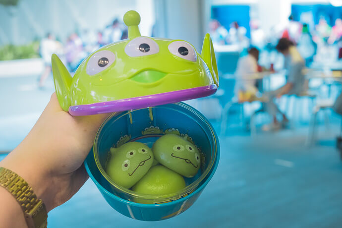 Toy Story Alien Mochi balls with Tomorrowland in background