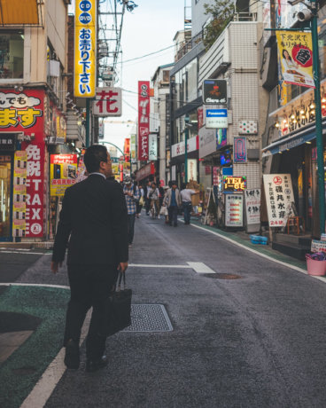 Japan Off the Beaten Path: Shimokitazawa - Salaryman walking down street.